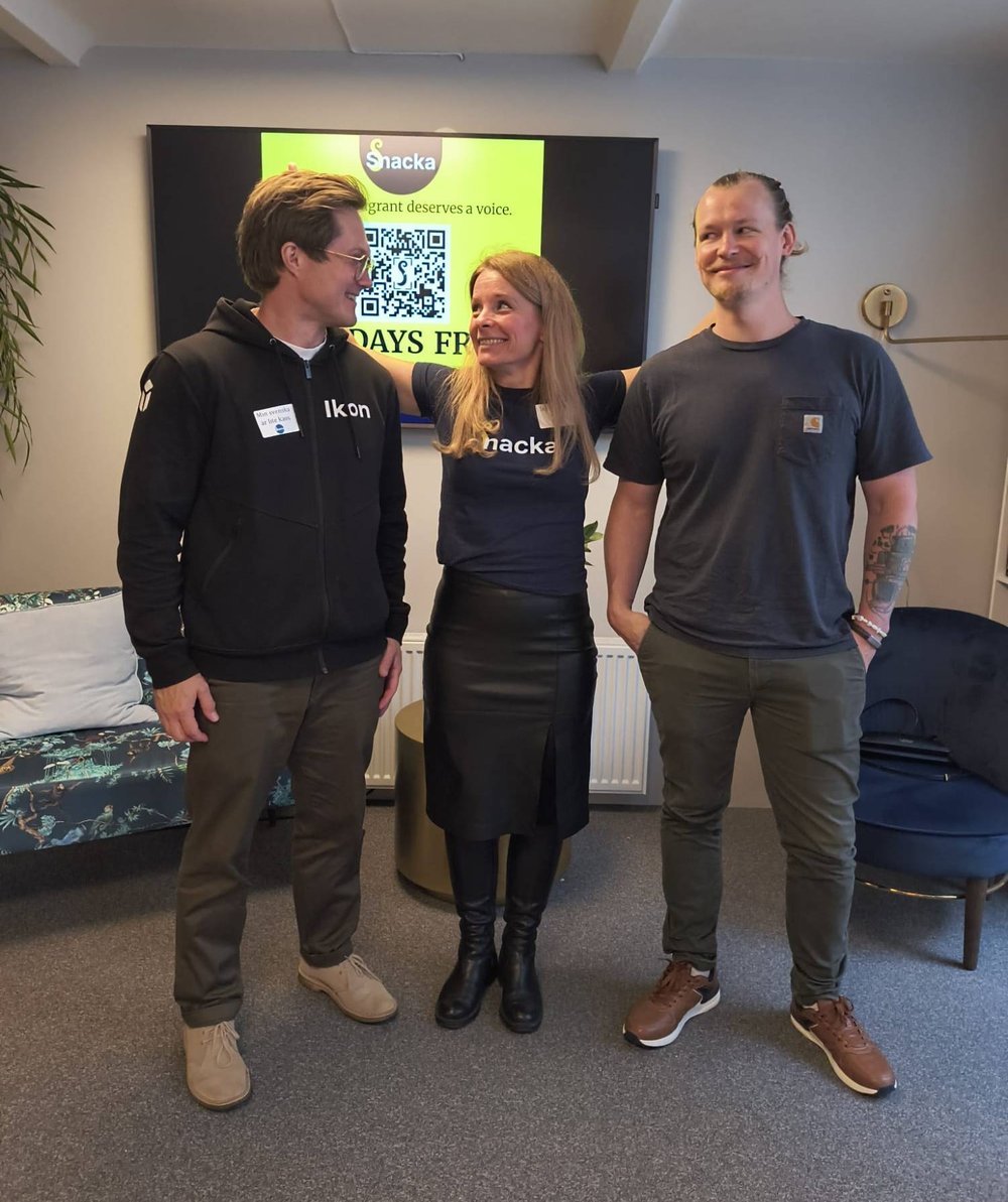 Raisa, Rasmus and a partner from Ikon laughing together at a pitch event